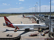 Overview of Melbourne's Tullamarine Airport Terminal 1 with a Qantas Boeing 737 and Jetstar aircraft